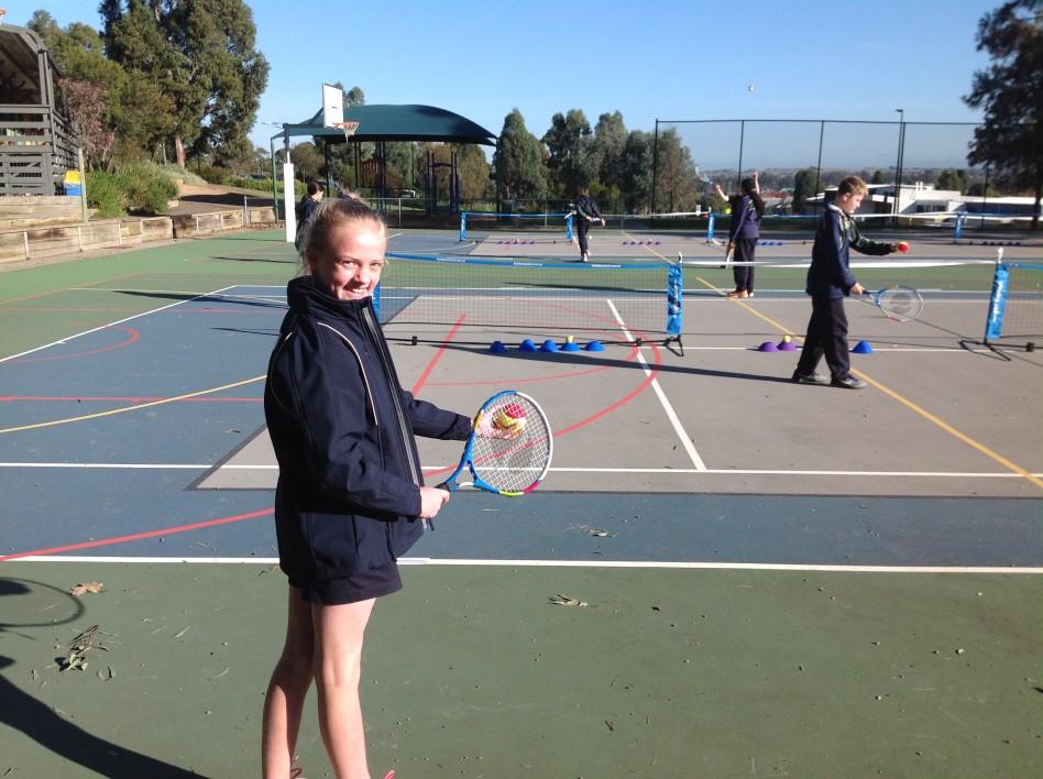 Hot Shots Tennis is a modified game, with lighter rackets and larger tennis balls. This has allowed all students to participate, experience success rallying the ball and have fun!
