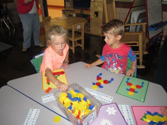 Math (Envisions) Students receive a whole group lesson, then practice math skills at Math Workshop (centers).