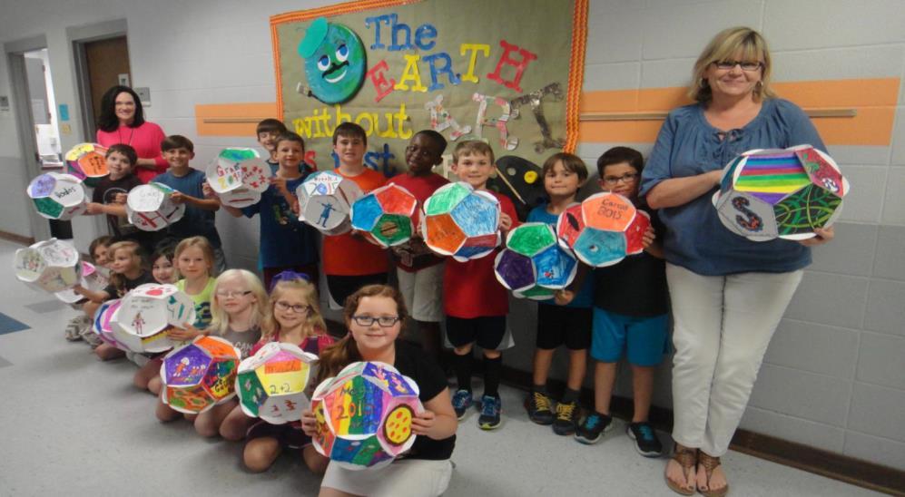 The second grade math team at Paine Primary School made Dodecahedrons for their final