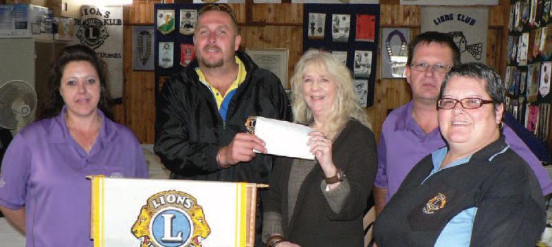 Lions Cindy, Ryan, Laurette, Peter and Teresa hand over R7,000 to Laurette Schoeman who also