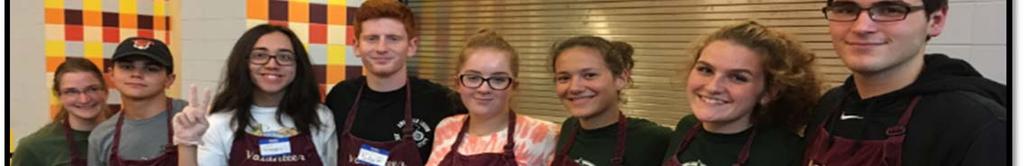 Grace A, Grace B, and Kolby worked in the kitchen putting together the plates of delicious fish, chips, and salad.