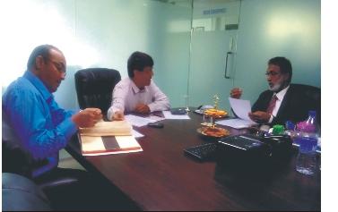 Martin from Spain. Mr. Ravi Jones in discussions with Mr. Ashok Gupta, Technical Director; and Mr.