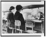 Image Image: Caucasian woman and African American woman, protesting segregation, sitting side by side on stools at a