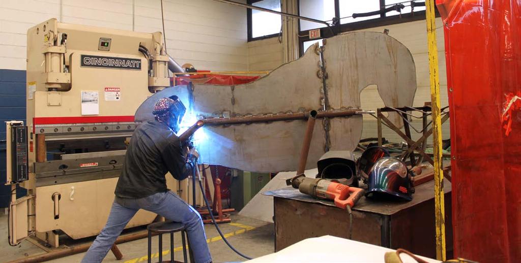 Erie County Technical student welds part of the horse s frame.