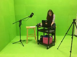 They are able to shoot and edit videos. Pictured is a student working on her video.