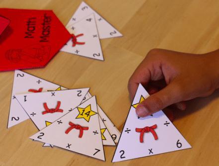 3. Make a deck of fact family triangles as shown for tables of 13 and 14 Eg: 14x1 =14 ( 14 written on the top), followed by 14 1= 14 and 14 14 =1 on the two sides of the triangle as shown.